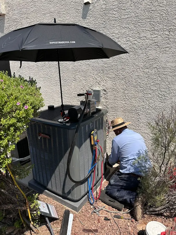 HVAC technician performing outdoor AC maintenance in Bridgewater
